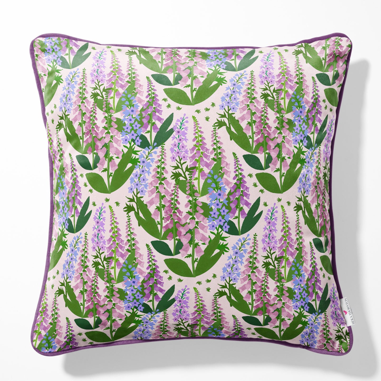 summer spires cottage floral cushion with piping in purple and pink colours