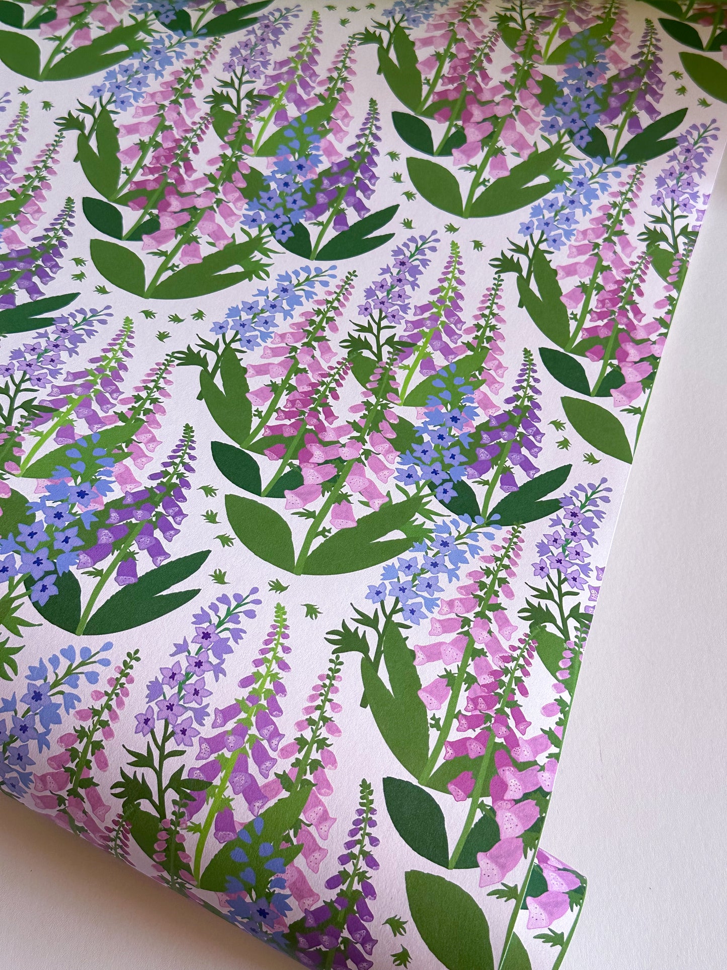 Summer Spires pink floral wallpaper with delphiniums and foxgloves by Reka Thornton