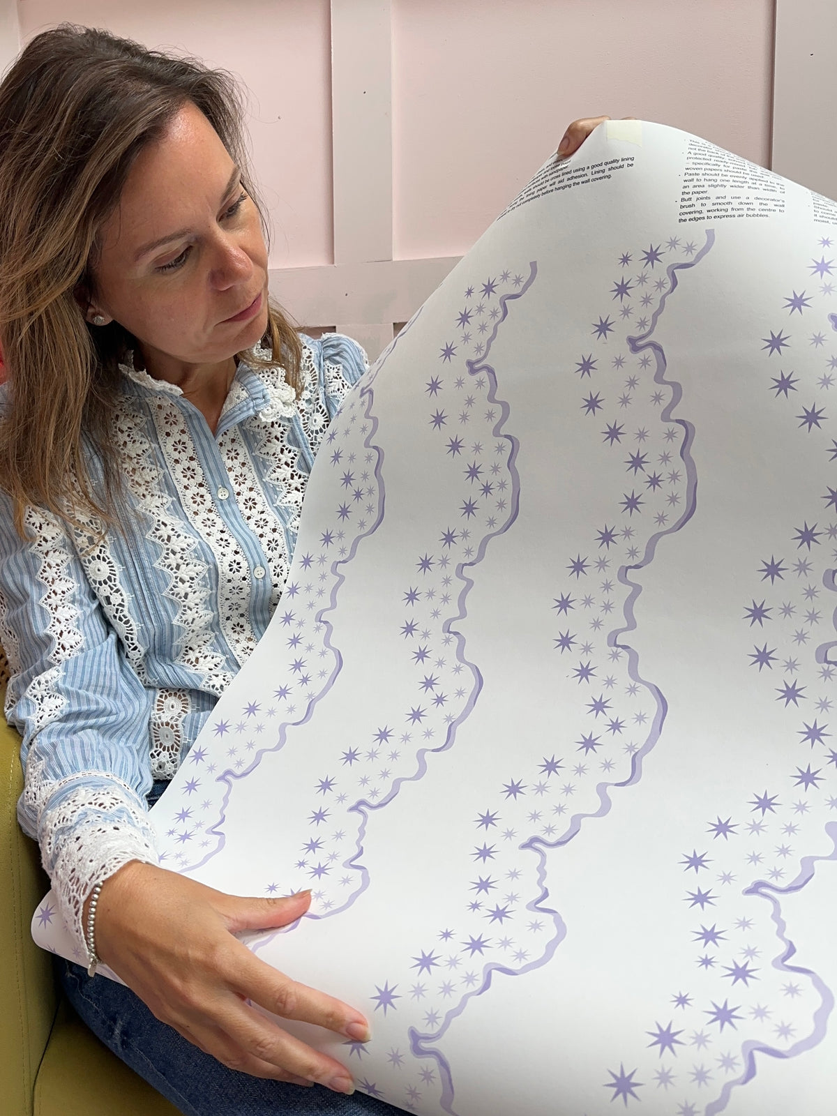 The Stars Above stars pattern wallpaper in pastel purple colour by Reka Thornton