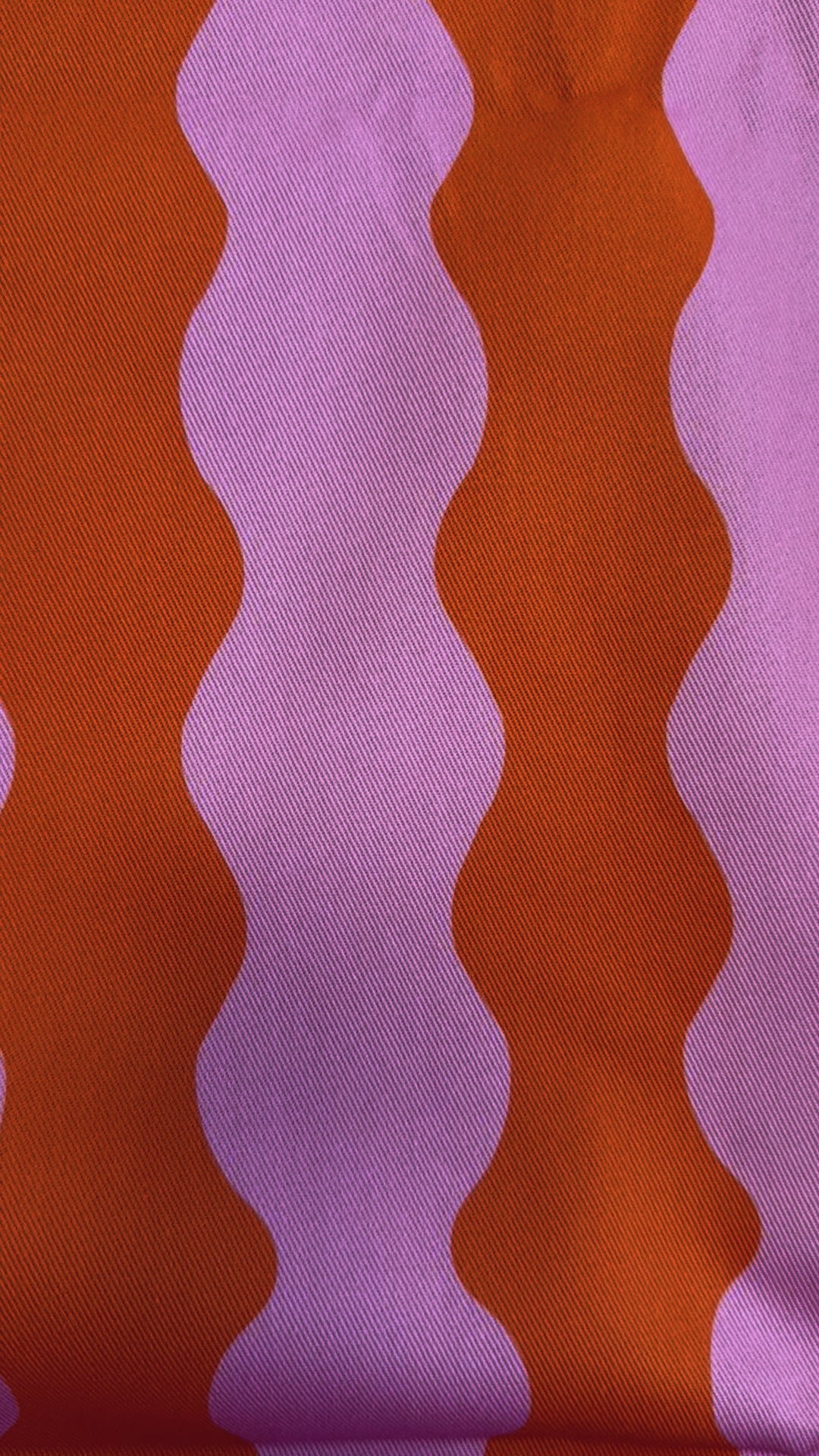 ‘Wiggle With Me’ wavy fabric in orange and pink colours